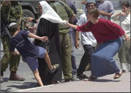 Elderly Palestinian woman being attacked by Jews
